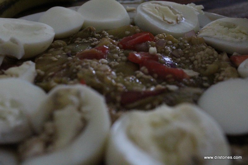 Boiled eggs arranged around a vegetarian dish