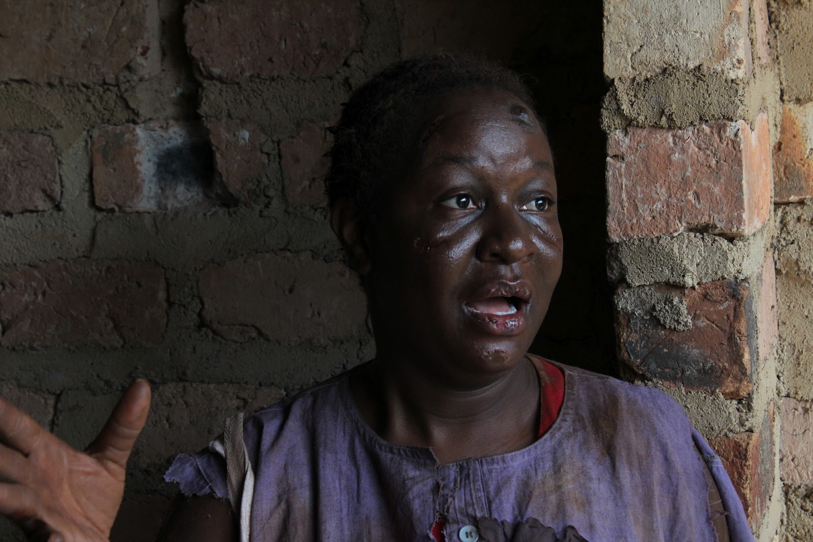 Close up of a black woman, an actress in a film scene, with a scared face, looking to the left of the camera, mouth slightly ajar as if in shock