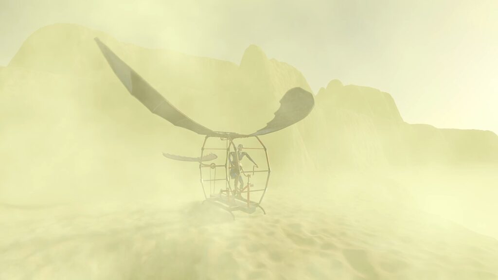 A misty world, yellow hues, an ornithopter with a humanoid riding it is just about visible in the yellow haze.
